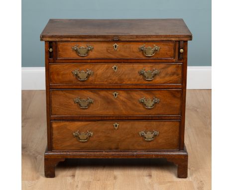 A George III mahogany bachelors chest With a fold-over top above four long graduated drawers and raised on bracket feet. 71cm