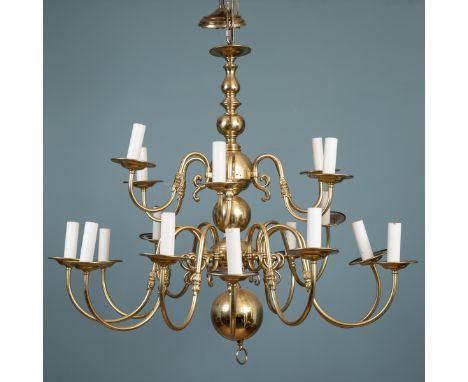 A brass eighteen-branch chandelier The branches divided into two tiers of six and twelve, on a bulbous support.95cm high (exc