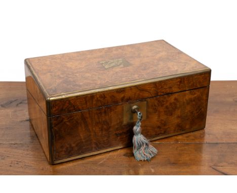 A 19th century burr walnut writing box With brass mounts, opening to reveal a red leather writing slope, the top of slope ope