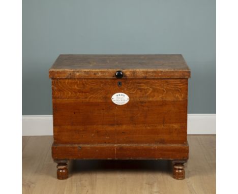 A faux oak cellarette by George Kent, High Holborn, London With iron carrying handles and a hinged lid opening to reveal a fi