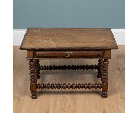 A Portuguese rosewood and teak low, side table With a frieze drawer and bobbin-turned legs and stretchers.66cm wide x 42cm de
