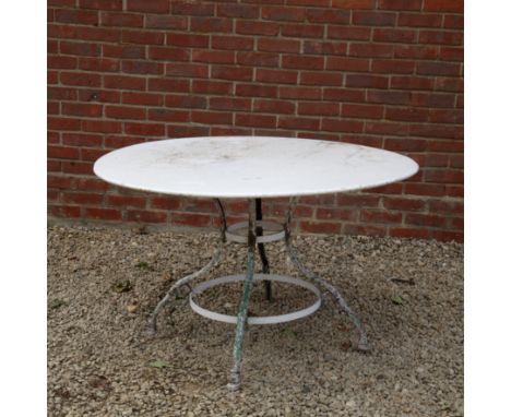 A late 19th/early 20th century French Arras white-painted wrought iron garden table With hoof feet.120cm diameter x 72cm high