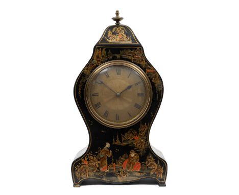 A mid-20th century mantle timepiece The black lacquered chinoiserie case with engine-turned decoration to the gilt Roman dial