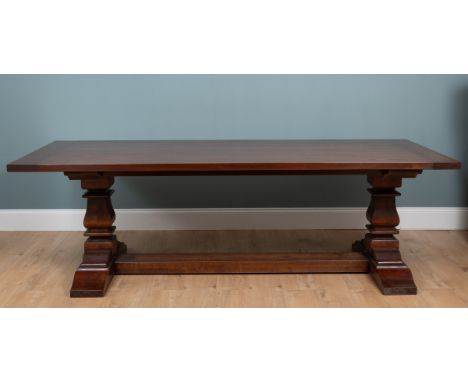 A contemporary cherry wood dining suite Consisting of a refectory-style table and ten chairs (two carvers and eight singles) 