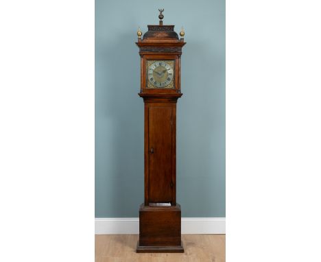 A mid to late 18th-century oak longcase clock The silvered brass Roman dial signed 'Baxter, Tewksbury' with central alarm set
