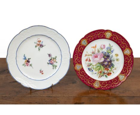Two Sevres plates The first early 19th century with a white, floral moulded ground and hand-painted floral decoration; the se