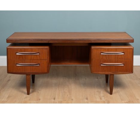 A G-Plan teak dressing table With an arrangement of five drawers.153cm wide x 46cm deep x 69.5cm highQty: 1In generally good 