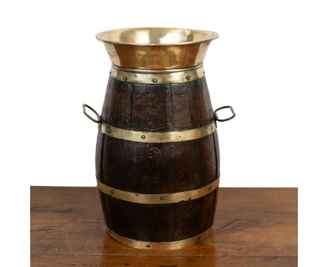 A brass-bound oak stick-stand With a flared rim and carry handles. 24cm diameter x 40cm highQty: 1Some losses to the brass. S
