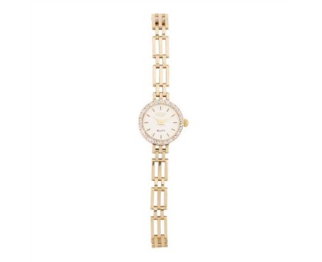 A lady's 9ct gold diamond set wrist watch, Rotary the circular dial with baton numerals, the bezel set with a single row of s