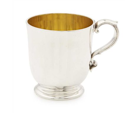 A Victorian christening mug Garrard, London 1880, of traditional form, gilt interior, leaf clasped S scroll handle, raised on
