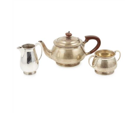 A modern three piece Bachelor's tea service Mappin &amp; Webb, Sheffield 1927, comprising; a teapot, twin handled sugar basin