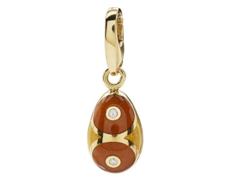 An 18ct enamel and diamond set pendant, Fabergé of egg form, the shaded enamel ground collet set with four round brilliant cu