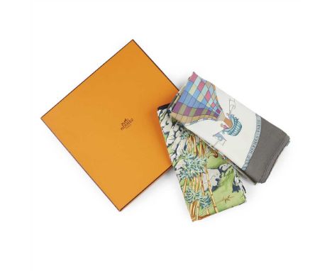 Two silk patterned scarves., Hermès the first with exotic animal motif, in original box; the second of blue grey colour, with