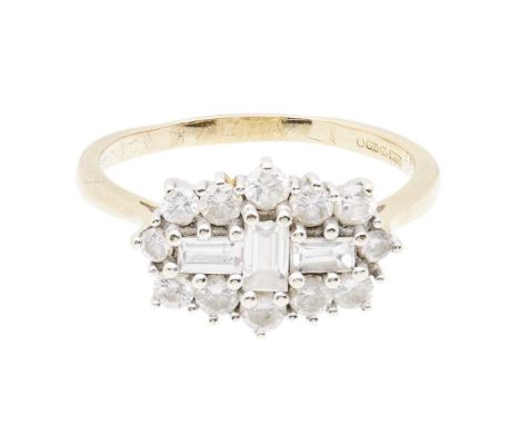 A modern diamond cluster ring claw set with three baguette cut diamonds, in a border of round brilliant cut diamonds, to a pl