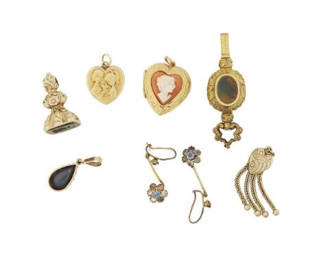 A collection of jewellery to include a pear shaped black opal pendant, a cameo set heart shaped locket; an agate set watch ke