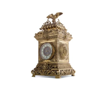 LATE 19TH CENTURY FRENCH BRASS MANTEL CLOCK,in the Empire taste, with eagle surmount above cast and pierced foliate detail th