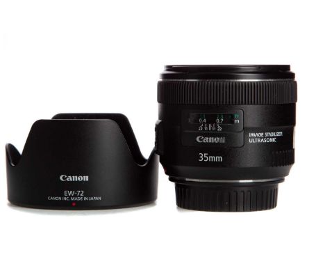 CANON EF 35MM 1:2 IS USM LENS,complete with front and rear caps and lens hoodMounting ring and body shows signs of light use,