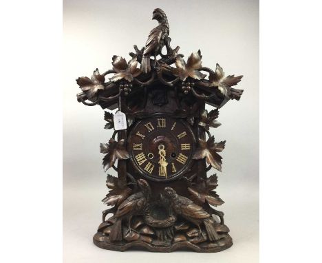 EARLY 20TH CENTURY BLACK FOREST CUCKOO CLOCK,by G.H.S.F., with two train eight day movement striking on a coil, the dial set 