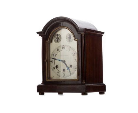 WEST END WATCH CO. MANTEL CLOCK,in domed mahogany case, the silvered dial set with slow/fast and chime/silent subsidiary dial