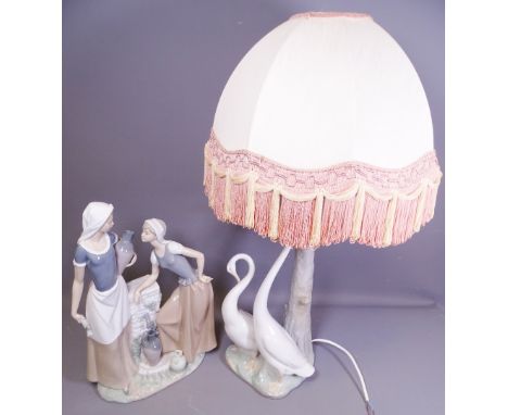 LARGE NAO PORCELAIN BIRD LAMP with tasselled shade, 67cms overall H and a large Nao porcelain figural group of two young girl