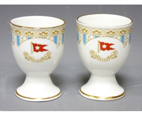 WHITE STAR LINE EGG CUPS, a pair, probably reproduction R D No 334028 and 'Titanic 1912' printed to the bases, 7cm heights