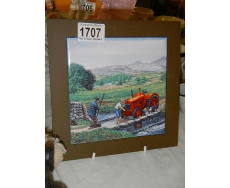 A ceramic teapot stand featuring a tractor.