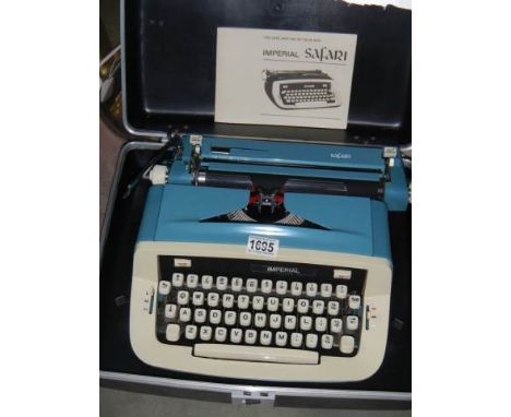 A good cased Imperial portable typewriter.