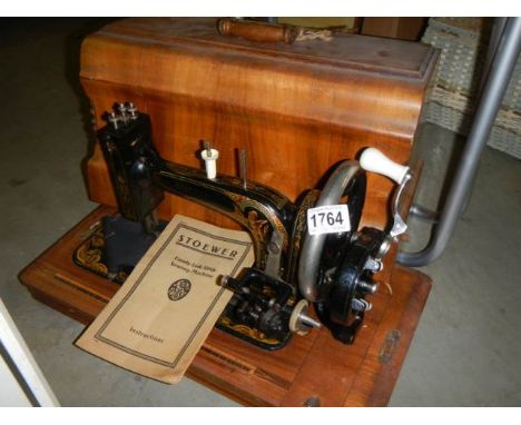A cased vintage Stoener sewing machine.