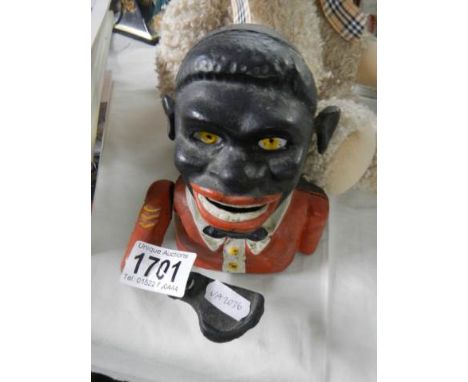 A mid 20th century cast mechanical money box. Notice from the the-saleroom.com: These items are listed on the basis they are 