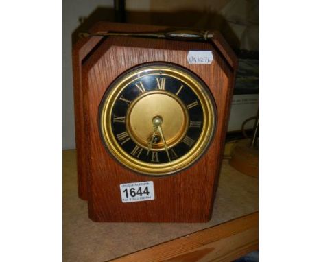 A 1920's oak mantel clock.