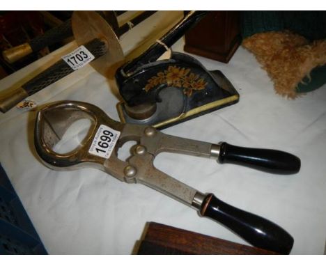 A cast metal company stamp and one other item.