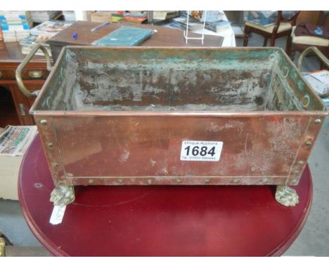 A good old copper planter with riveted sides.