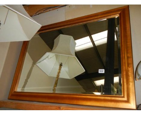 A large gilt framed bevel edged mirror in good condition, COLLECT ONLY.