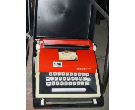 A good cased Petite portable typewriter.