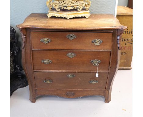 A three-drawer commode, Holland, Louis XVI, 4th quarter 18th century. Oak wood, curved front, chamfered styles with carved le