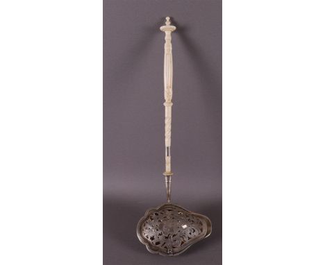 A silver sauce ladle with pierced valve lid on partly twisted bone handle, Germany, 1st half 19th century. Shell-shaped conta