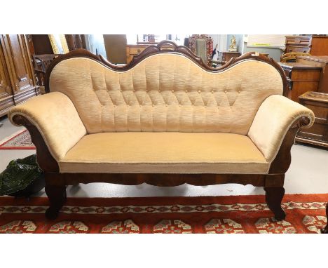 A three-seater sofa with pink fabric upholstery, Holland, mid 19th century. Mahogany, contoured back window with carving in l