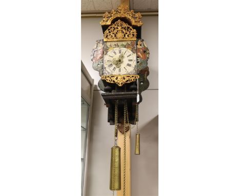A chair clock, Friesland, 19th century. Polychrome decorated wooden chair. The hood and the attic lead with medallion, style 