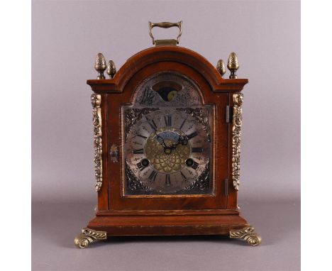 A table clock in burr walnut case, 2nd half 20th century. Movement with moon indication, dial with Roman numerals, Warnink, h