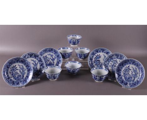 A series of six blue and white porcelain cups and saucers, China, Kangxi style, 19th century. Blue underglaze floral decor, m
