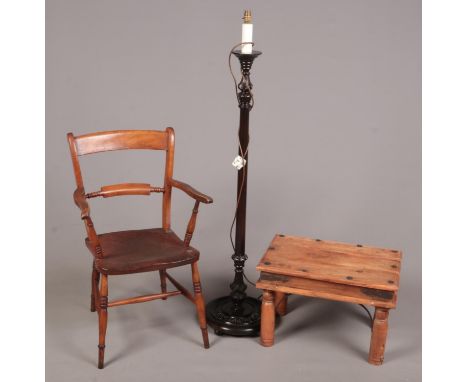 A trio of wooden furniture - comprising of an Elm chair with turned legs, a wooden coffee table and a dark wooden floor lamp.