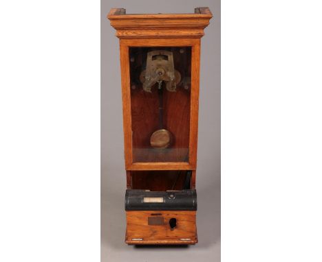 A vintage light oak clocking in machine.  