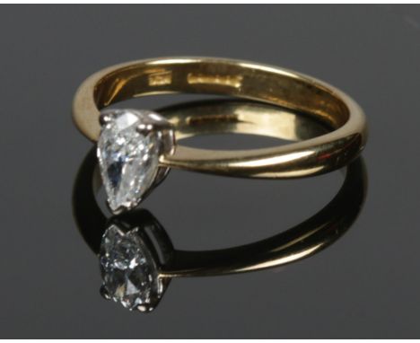 An 18ct gold and pear shaped diamond ring, stamped 41 to inside of the shank. Size K. Weight is 2.55g  