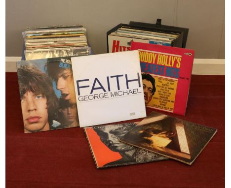 A collection of vinyl LP records. Kate Bush, The Rolling Stones, Buddy Holly, George Michael examples etc  