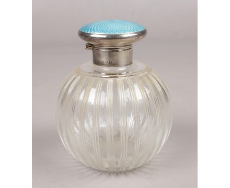 A George V globular glass scent bottle with silver and blue guilloche enamel hinged top. Assayed Birmingham 1921.  Good condi