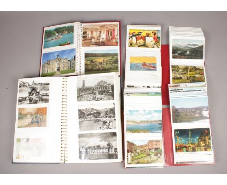 Four albums of colour and monochrome postcards. Includes vintage and humorous examples.  
