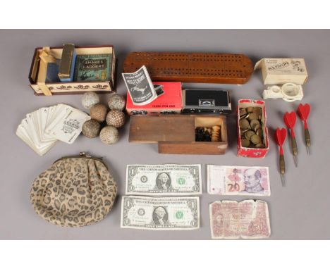 A collection of mostly vintage games - comprising of a mini wooden chess set (complete), vintage golf balls, a selection of p