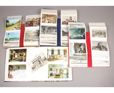 Four albums of colour and monochrome postcards. Includes vintage examples.  
