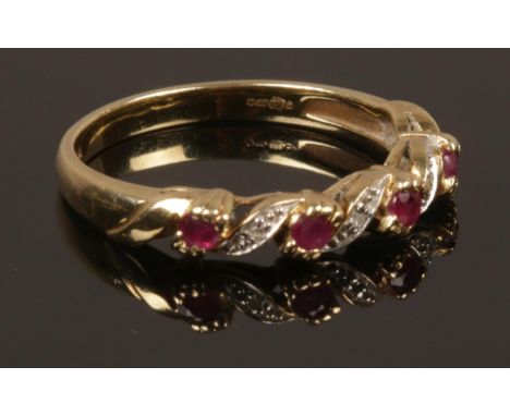 A 9ct gold ruby and diamond ring. Size O. Weight 2.17g.  