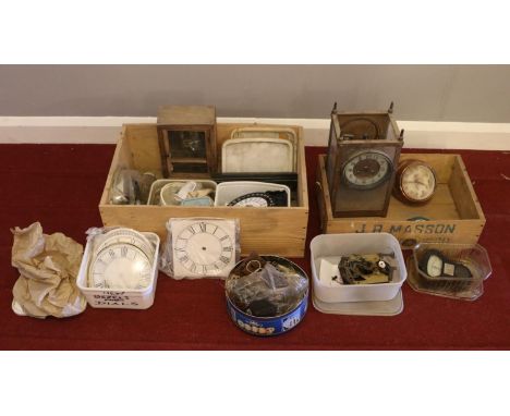 Two boxes of clock parts - comprising of clock keys, locks, ceramic faces and Bezels etc.  